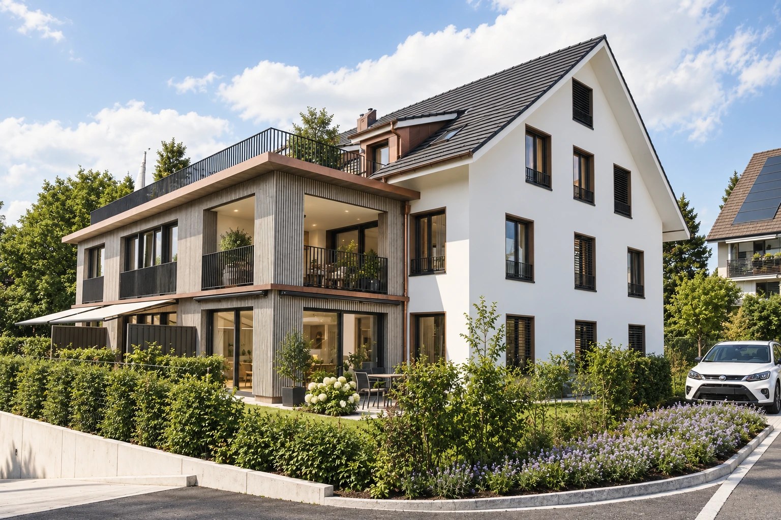 Modernes Mehrfamilienhaus mit Holzfassade und Garten im Zürcher Unterland
